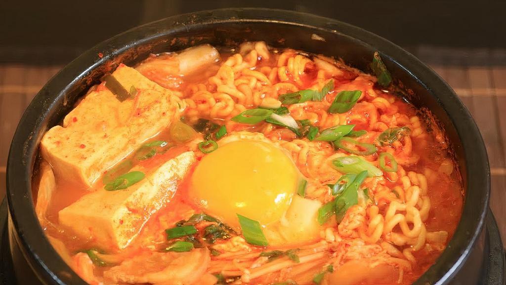 Kimchi Ramen - Mì Kimchi · Spicy Kimchi soup with ramen, sliced rare beef, beef meatballs and egg.