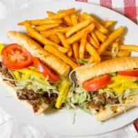 Chicken Cheesesteak · Chopped chicken breast, provolone cheese, and sautéed onions loaded with lettuce, tomato, ba...
