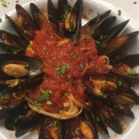 Mussles Linguine · Fresh  mussles sauteed with roasted garlic, tossed into linguine pasta, with your choice of ...