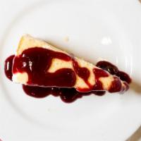 New York Cheesecake · Creamy cheesecake topped with your choice of raspberry or chocolate glaze.