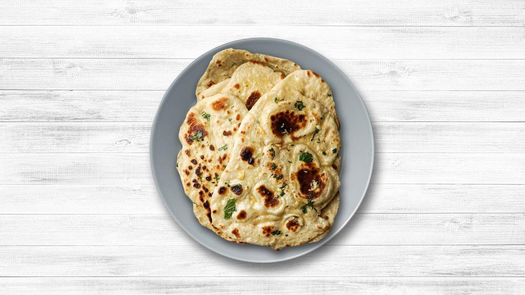 Garlic Garlic Naan · House-made pulled and leavened dough pressed with finely chopped garlic and baked to perfection in an Indian clay oven.