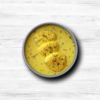 Rasmalai · Cottage cheese patties steeped in rich  in infused milk