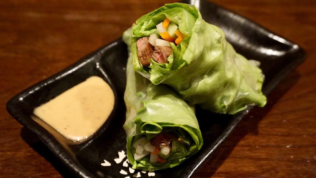 Fresh Spring Roll (2) · Gluten Free.  Chicken/beef/shrimp with homemade pickled carrot and radish, Japanese cucumber, fresh leaf lettuce wrapped in rice paper with roasted sesame sauce.