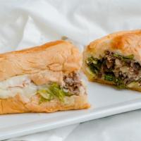 Steak & Cheese · Lettuce, tomato, grilled onion, mayo and Provolone cheese on a sub