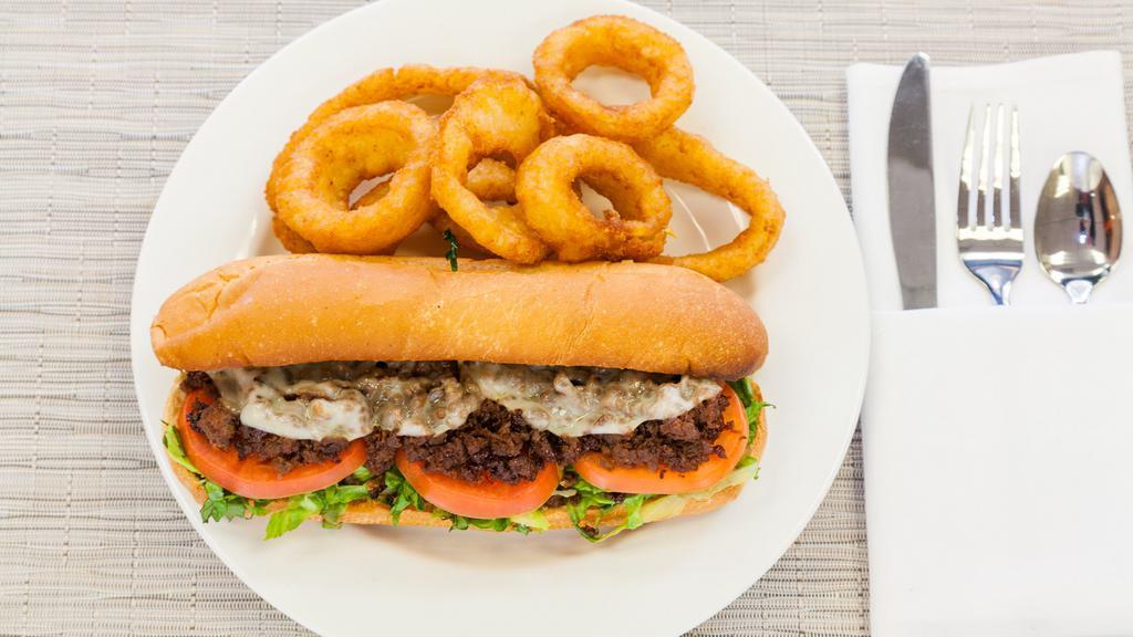 Royal Steak & Cheese · Mushroom, green pepper, lettuce, tomato, grilled onion, mayo, and Provolone cheese on a sub roll.