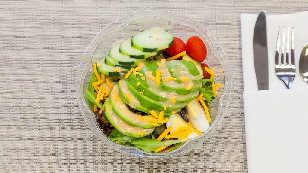 Veggie Salad · Fresh Sliced Avocado, Boiled eggs, Tomato, Dried Cranberries, Cucumber, and Cheddar cheese on Mixed greens.