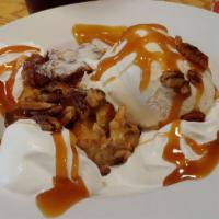 Bread Pudding(Favorite) · Served warm with ice cream, pralines, caramel and topped with whipped cream.