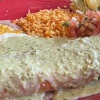 Enchiladas Borrachas · 2 enchiladas filled with Cheddar cheese and chicken, topped with a creamy tequila cilantro p...