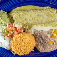 Santa Fe Chimichanga · Chicken or beef with cheese topped with a poblano queso dip. Served with guacamole and sour ...