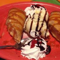New York Cheesecake Chimichanga · Rich smooth new York style cheesecake rolled in a flaky pastry tortilla dusted whit cinnamon...