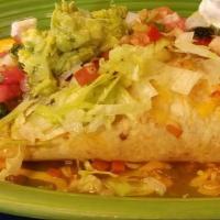 Carne Asada Burrito · Two burritos stuffed with tender skirt steak, refried beans, and Mexican rice. Topped with z...