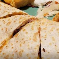 Fajita Quesadilla · Flour tortillas stuffed with cheddar and jack cheese, your favorite fajita meat and pico de ...
