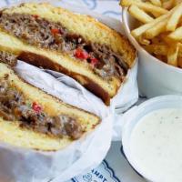 The Cheesesteak · Hot Shaved Beef, Caramelized Onions,. Bell Peppers, Cooper’s White American. Jalapeño Ranch