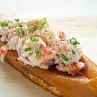 Maine Lobster Roll · Chilled N.E. Atlantic lobster knuckle + claw meat. tossed in a light herb aioli.