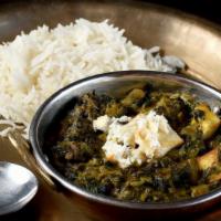 #27. Palak Paneer · Minced spinach with homemade cheese cubes in a light creamy sauce.