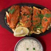 #60. Chicken Tikka Tandoori · Boneless chicken breast first marinated with special herbs and spices along with yogurt then...