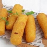 Sorullos · Corn fritter filled with cheese.