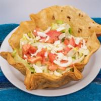 Taco Salad · Fried flour tortilla shell filled with refried beans, lettuce, cheese, sour cream, guacamole...