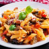 Penne Alla Sorrentino · Penne pasta sautéed in a pink sauce with roasted eggplant, portobello mushrooms, sun-dried t...