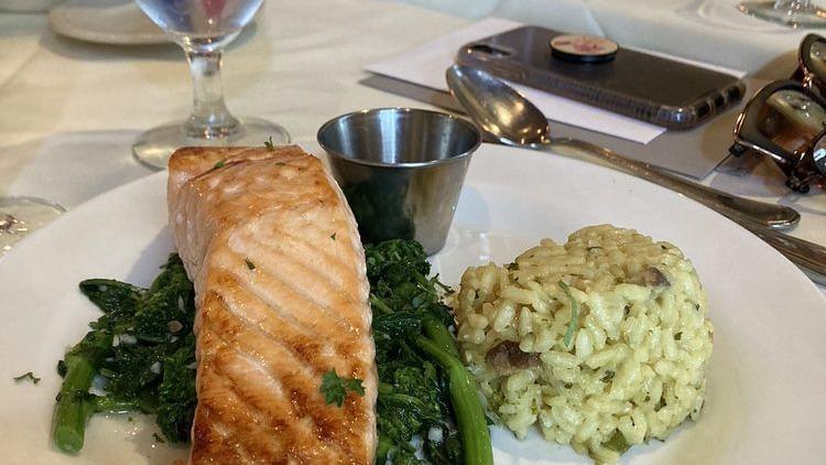 Atlantic Salmon · Atlantic salmon broiled with olive oil, garlic, lemon and white wine served with sautéed broccoli rabe and risotto.