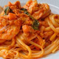 Shrimp Marinara · Shrimp freshly sautéed in our delightful marinara sauce with spinach served over a bed of Li...