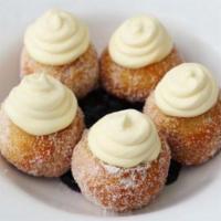 Bonuts · Fried Biscuit Dough, Tossed in Sugar, Topped with Lemon Mascarpone, Served Over Blueberry Co...