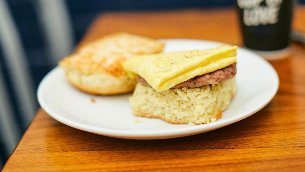 E.C. · Buttermilk Biscuit Topped with Smoked Sausage, One Scrambled Egg and Aged Cheddar. Add Sausage Gravy for an Additional Charge.