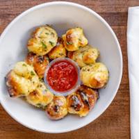 Garlic Knots · Six of our delicious homemade bread dipped in our garlic sauce. Our local favorite!.
