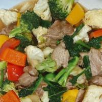 Garlic American Broccoli · Your choice of meat cooked with American broccoli, garlic, carrots, tomatoes and homemade sw...