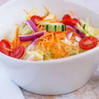 House Salad · Tomato, lettuce, spring mixed green salad, carrot, cucumber, and red onion served with homem...