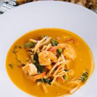 Red Curry · Spicy. Thai red curry and coconut milk served with your choice of meats, bamboo shoots, pea,...