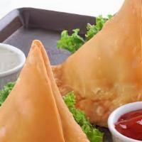 Samosa · 2 Pieces of triangular fried patty filled with potatoes and spices