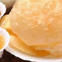 Halwa Puri · Two deep fried flour bread served with chickpeas and halwa.