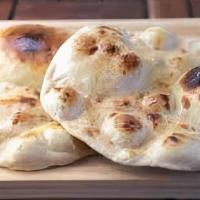 Tandoori Roti · Flat whole wheat bread prepared in tandoor (clay oven)