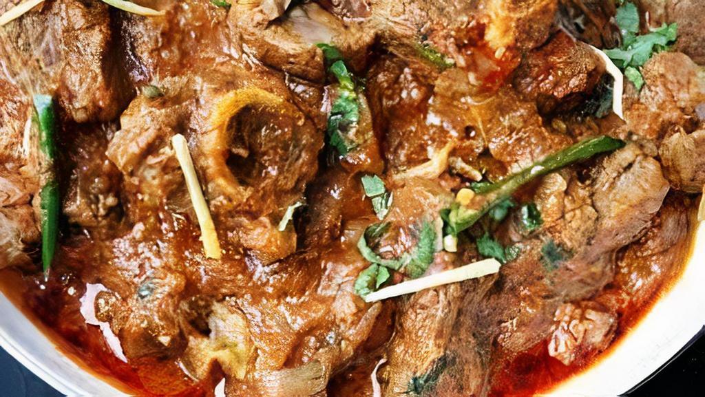 Goat Karahi · Prepared in a reduced tomato based sauce with fresh cilantro jalapeno and ginger
