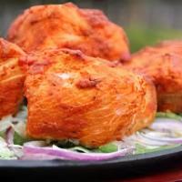 Tandoori Salmon · Small pieces of Salmon Fish marinated with special herbs and spices perfected over an open f...