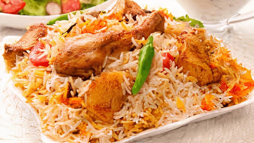 Chicken Biryani · Chicken chunks cooked in basmati rice and mild spices