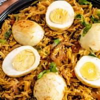 Egg Biryani · Basmati rice with boiled eggs in a blend of herbs and saffron.