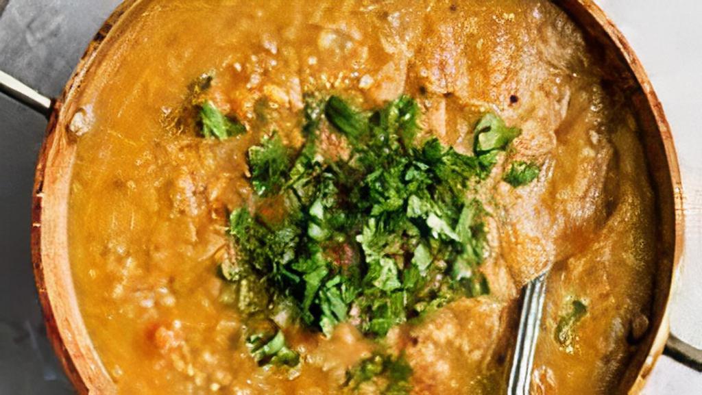 Daal Tadka  · Yellow lentils and beans combined with our home made onion sauce, spices and cooked to get a tadka texture