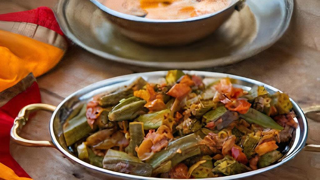 Bhindi Masala · Small pieces of Okra cooked in tangy sauce and spices.