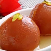 Gulab Jamun · Two deep fried waffle balls soaked in rosewater and honey syrup