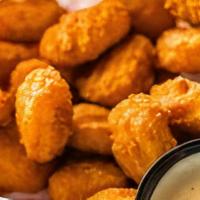Corn Nuggets Appetizer · Golden sweet cream corn breaded and fried to a crispy golden brown. Served with ranch dressi...