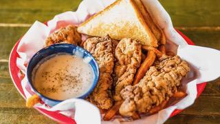 Steak Finger Basket · Four beef cutlet strips breaded in seasoned flour and served with a cup of creamy gravy, fri...