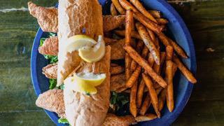 Catfish Po' Boy · Catfish on a toasted roll with tartar sauce, lettuce and tomato served with choice of fries or cherry creek chips.