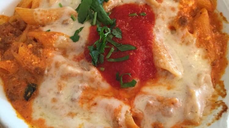 Pasta Al Forno · Penne pasta, tomato sauce, ground beef, ricotta, and mozzarella cheese, baked to perfection.