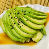 Avocado Salad · Sliced avocado over cucumber topped with ponzu sauce and sesame.