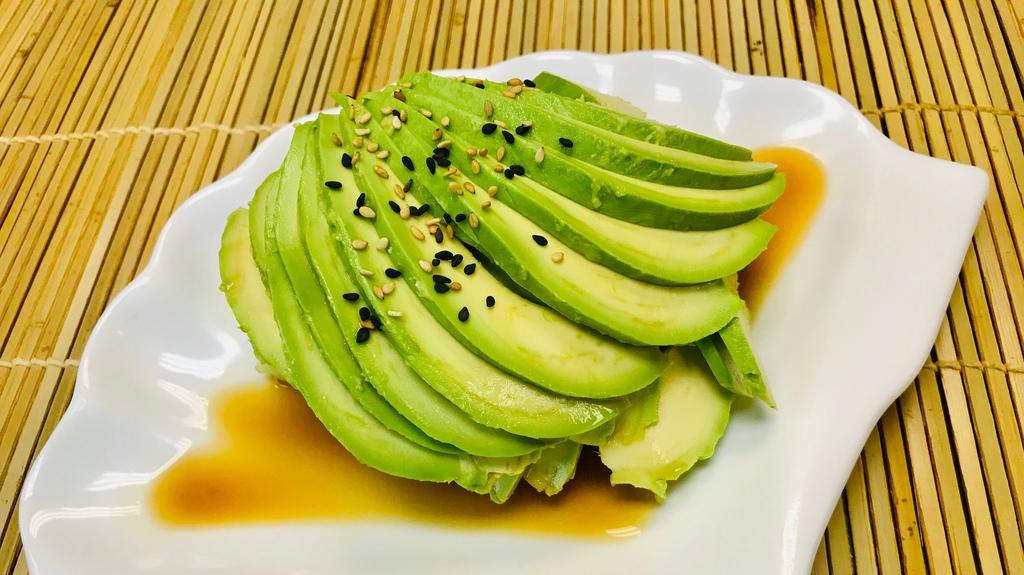 Avocado Salad · Sliced avocado over cucumber topped with ponzu sauce and sesame.