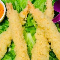 Mango Shrimp · Four Pieces. Crispy shrimp tempura over lettuce with mango dressing.