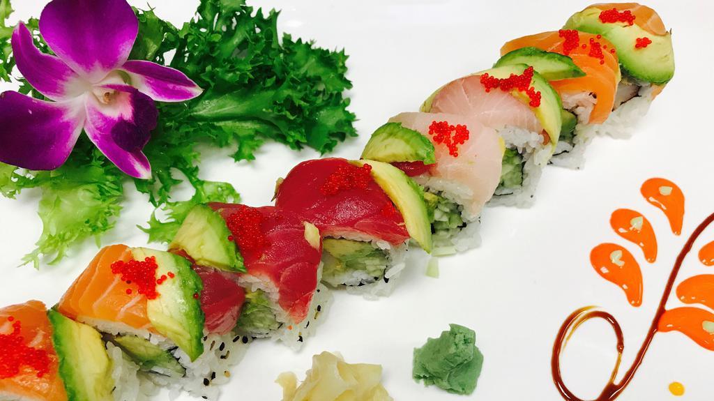 Rainbow Roll · Eight Pieces. Inside: crab meat and cucumber. On top: tuna, salmon, yellowtail, avocado and masago.