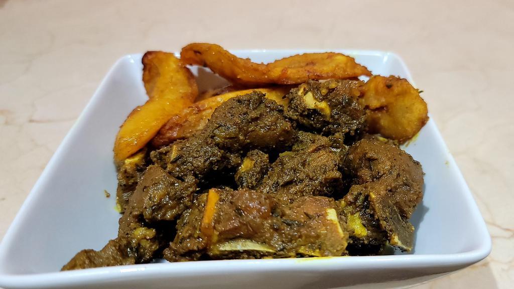 Curry Goat Meat · Goat meat marinated with curry flavor and authentic herbs and spices.